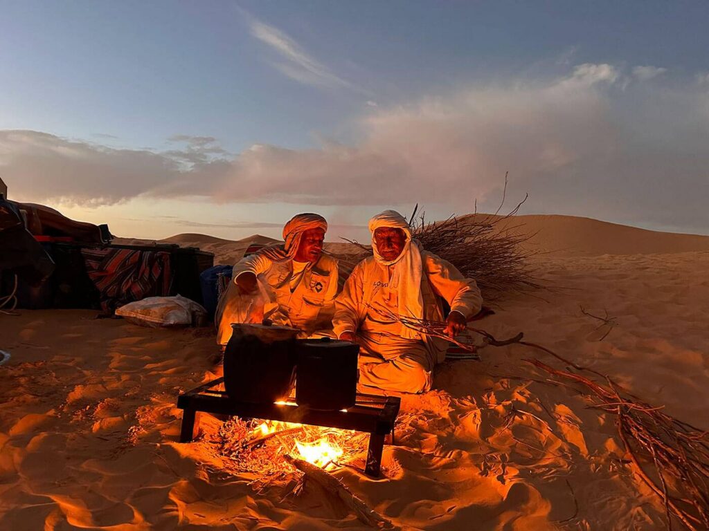 Tunisian off-road tour guides around the campfire in the desert